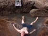 Me cooling off in a tide pool while hiking along the rocks towards Butterfly Beach