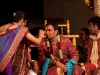 Women from the bride\'s family put a tikka on the groom.