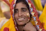 pushkar-fair Smiling woman watching the closing ceremonies of Pushkar Camel Fair.