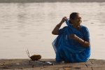 ujjain Woman performing a puja along the river, Maheshwar