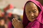 xiahe Monk watching the performance during the festival at Labrang monastery, Xiahe.