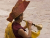 Monk playing horn, Hemis Festival.