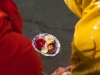 Women offering flowers to the Ganga on Somavati Amavasya