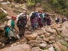 Women of Langtang on their way down to retrieve articles for a new gompa