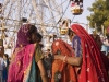 Women shopping in front of a Ferris Wheel, Pushkar Fair.