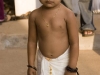 Yong boy dressed in dhoti to enter the Sri Krishna temple in Guruvayur, Thrissur District.