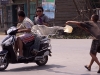 Kids throwing water on a passing motorbike for Yaoshang.